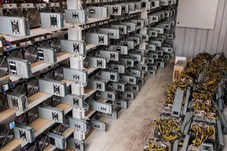 A large-scale mining farm with rows of mining machines running continuously.
