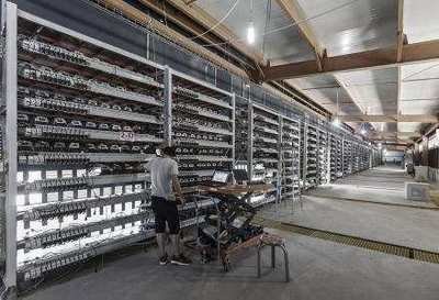 Mining farm with rows of ASIC miners